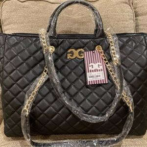 Gilda Paris large quilted black tote travel bag with gold chain and logo.
